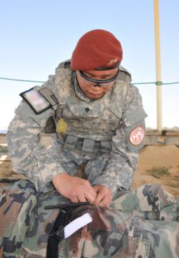 Sgt. Thomas Duval Spc. Ricardo Gonzales, a combat medic from the Minnesota National Guard, currently serving in the Sinai Peninsula of Egypt with Task Force Sinai, performs first aid on a simulated casualty during the unit's Best Warrior Competition held March 18, 2015. During the competition Soldiers underwent a number of mental and physical tests that included trauma lanes, physical fitness test, weapons qualification and a formal board, among others. (U.S. Army Photo By: Sgt. Thomas Duval, Task Force Sinai Public Affairs)